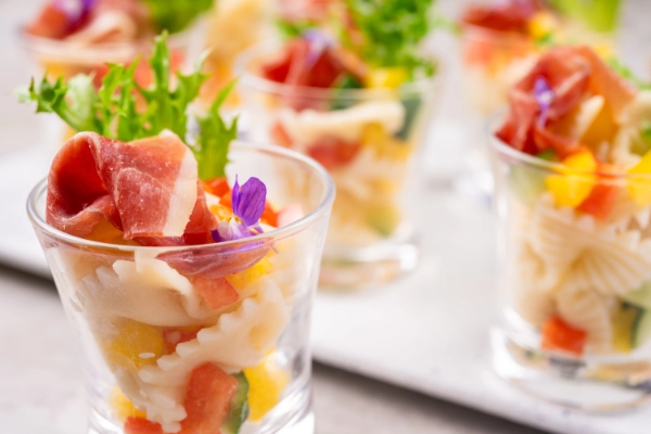 Spring cabbage salad with prosciutto and farfalle